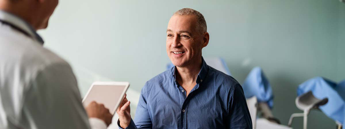 A man visiting a doctor for a consultation on his spine pain.