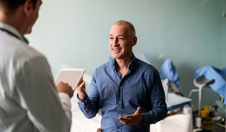 A man visiting a doctor for a consultation on his spine pain.